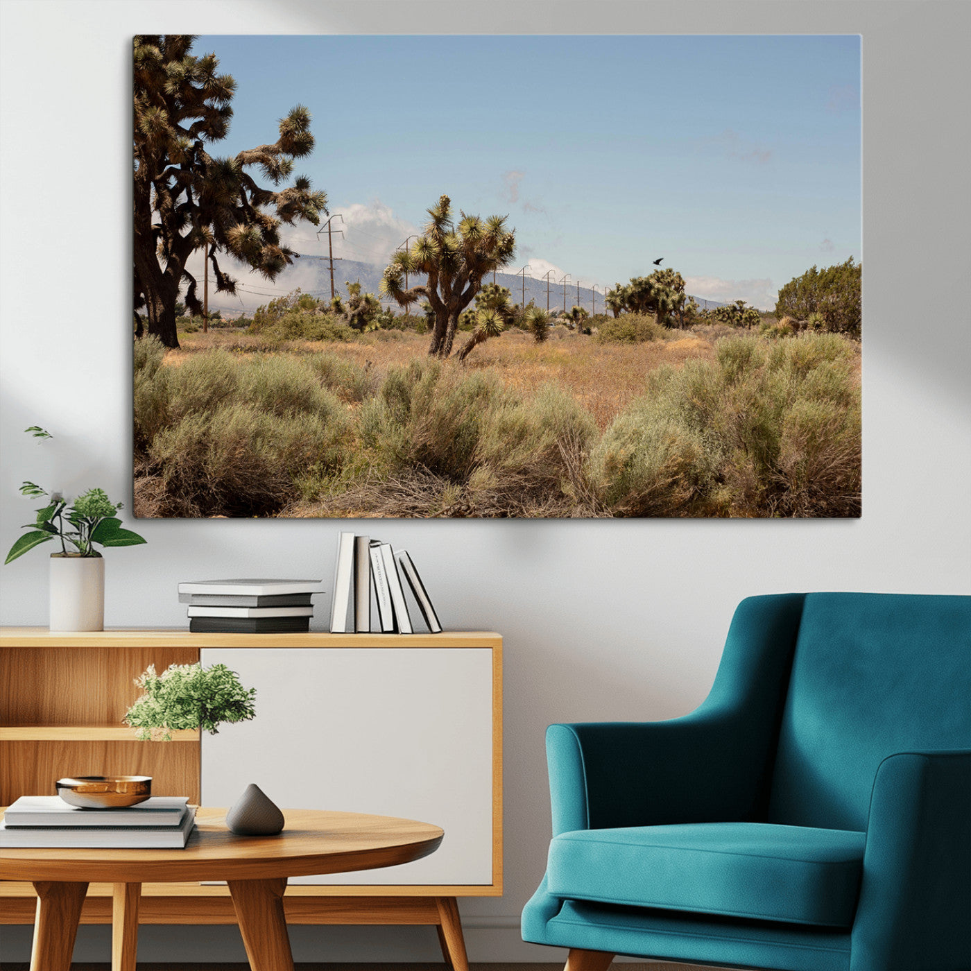 Scenic desert landscape with Joshua trees, dry grass, and distant mountains under a clear blue sky, perfect for southwestern and rustic decor.