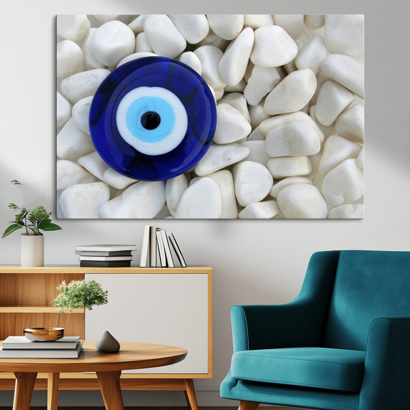 A close-up of a blue evil eye charm placed on white pebbles, symbolizing protection and good luck.