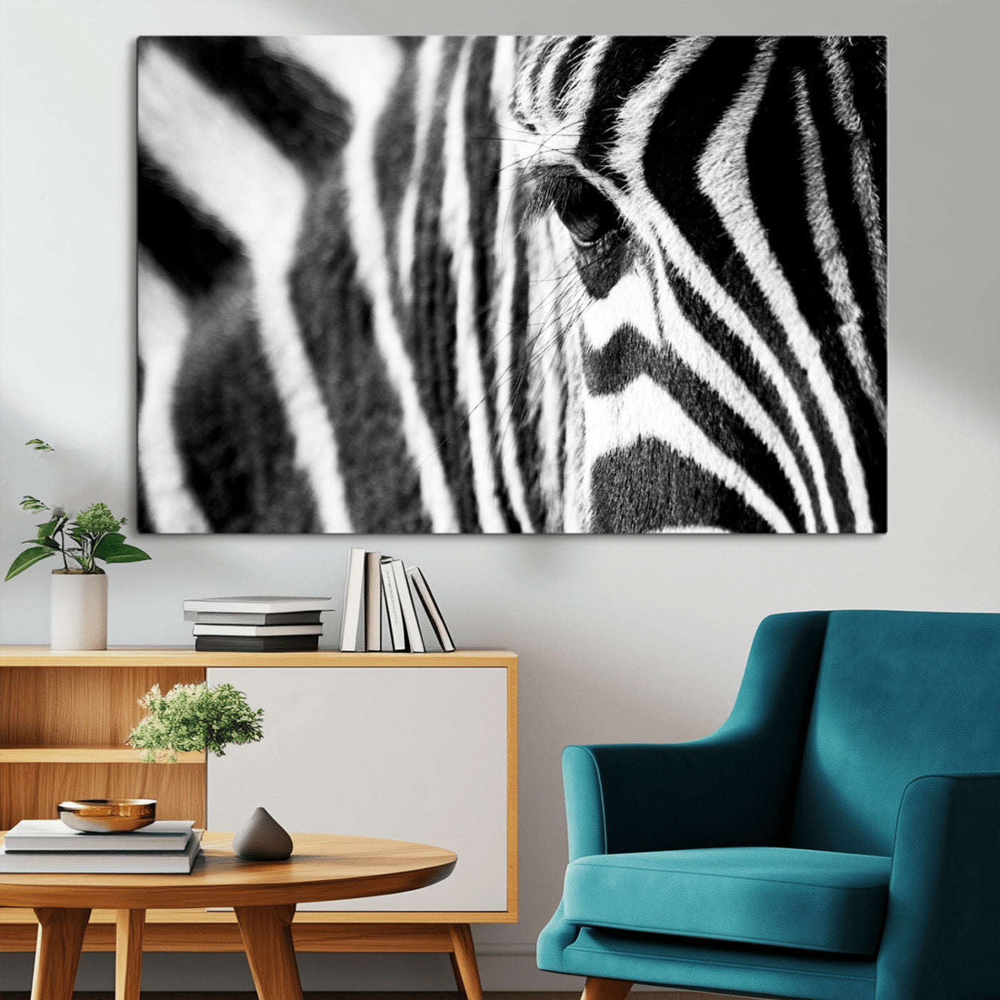 A close-up black and white photograph of a zebra's eye, showcasing the intricate patterns of its stripes in sharp detail.
