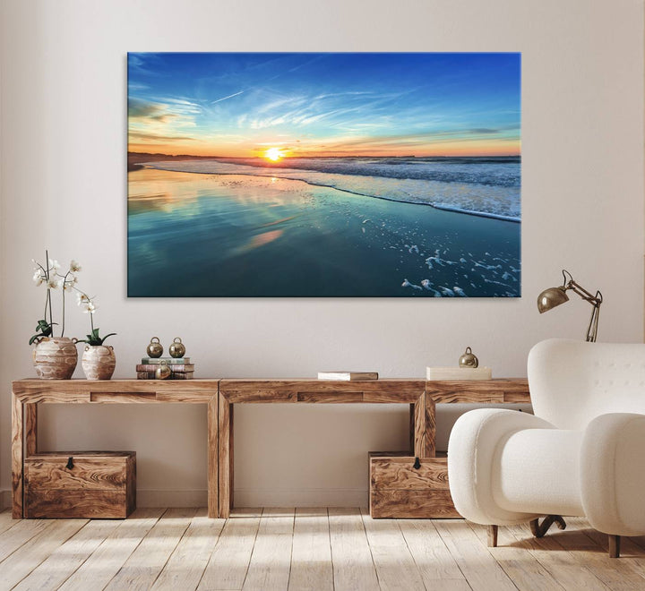 The Blue Sky and Beach Wall Art Canvas Print features a vibrant orange sky reflecting on wet sand.