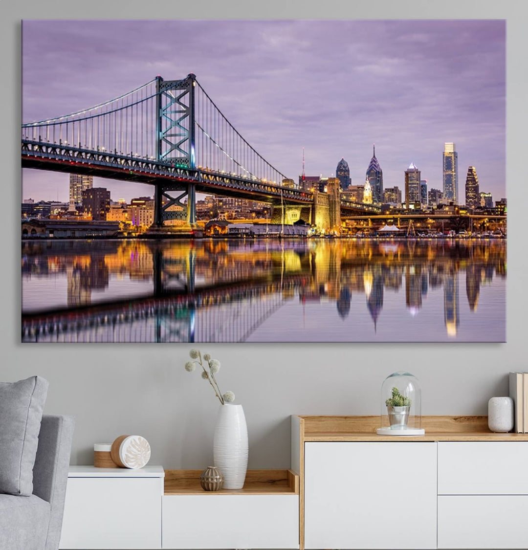 A woman holds the Philadelphia Ben Franklin Bridge Wall Art Canvas Print, a gallery-quality photo showcasing a city skyline with the bridge reflecting on the river. This stunning piece would make an excellent addition as premium canvas wall art for any home.