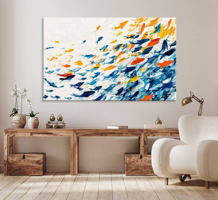 A colorful Abstract Fish Shoal Canvas Print hangs on the wall.