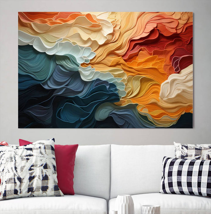 A Blue Orange Abstract Wave Wall Art Canvas Print adorns the wall. This colorful masterpiece is professionally hand-assembled to enhance any space.