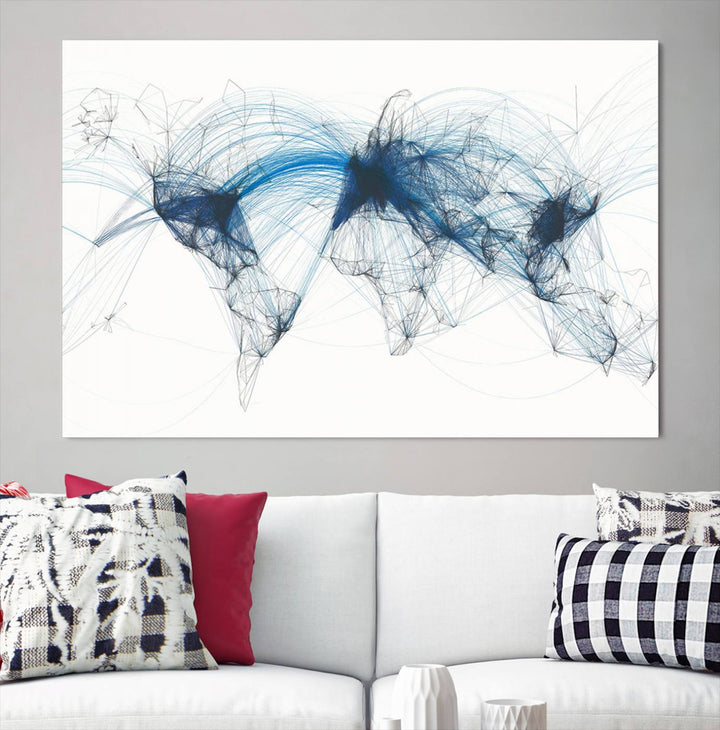 The Aviation Flight Map Wall Art is a set of three abstract panels featuring a world map with blue lines, resembling a flight map. Ideal for aviation enthusiasts, this ready-to-hang framed air traffic art print enhances the appeal of modern decor.