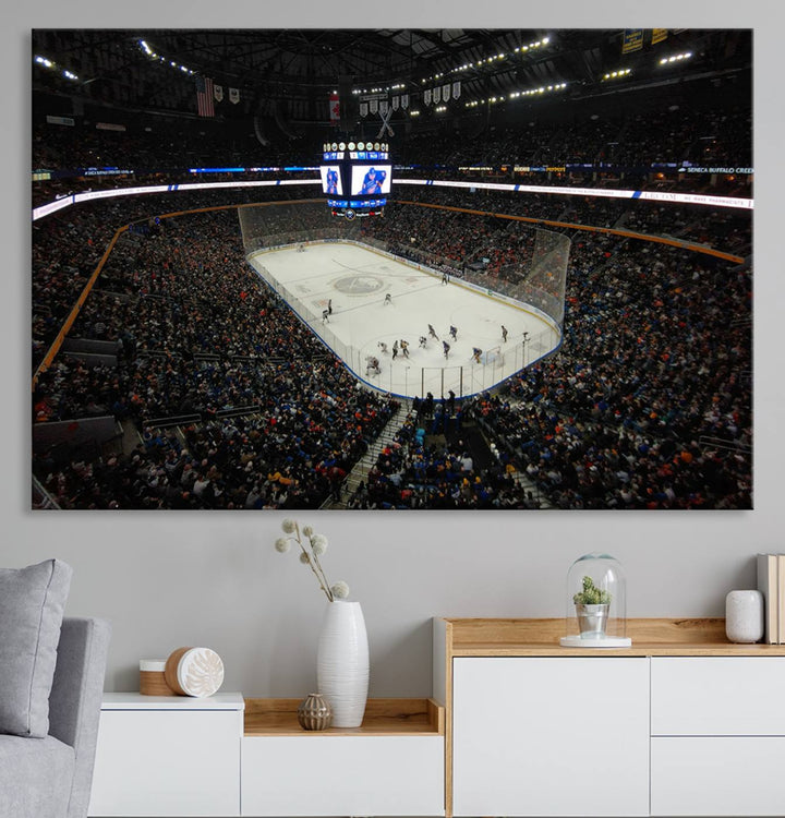 The nautical-themed room is enhanced by the KeyBank Center New York Buffalo Sabres Hockey Stadium Wall Art Canvas Print, a three-panel depiction of a bustling hockey arena with a gallery-quality finish. This canvas artwork, handmade in the USA, introduces an element of sporting elegance to your decor.