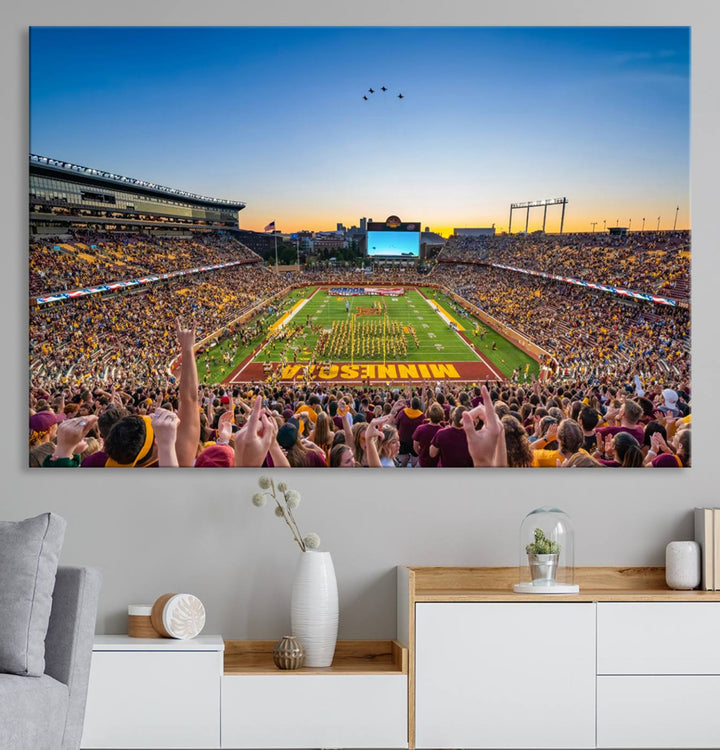 Canvas wall art featuring the University of Minnesota Football Team print, showcasing Huntington Bank Stadium at sunset with jets overhead.