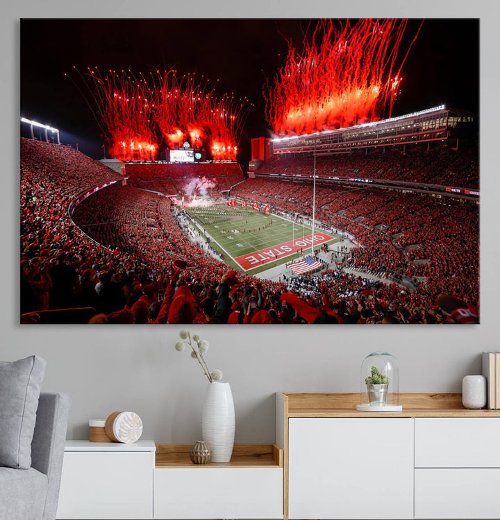 A vibrant red canvas art of a packed Ohio State Buckeyes stadium at night with fireworks.