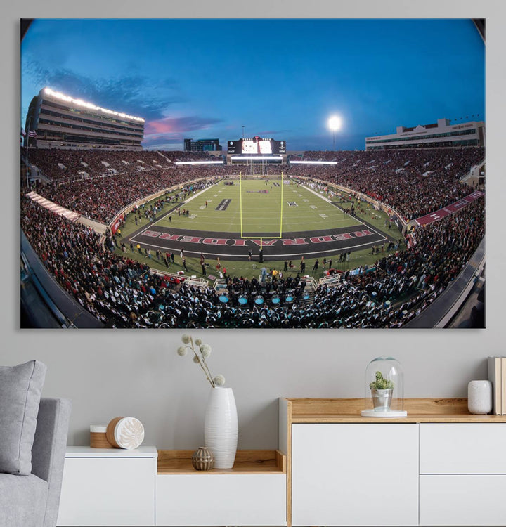 The wall art in the living room features a Texas Tech Red Raiders Football Team Print, showcasing Jones AT&T Stadium at dusk.