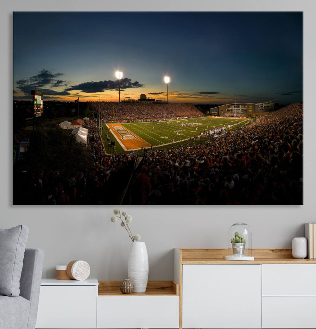 Ball State Cardinals Football Team Print - Muncie Scheumann Stadium Canvas featuring a sunset, floodlights, and lively crowd.