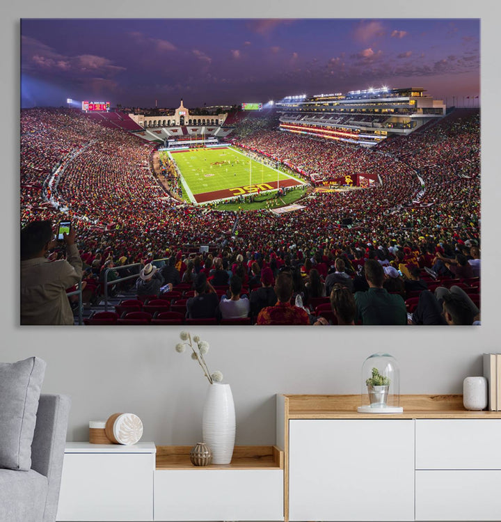 The vibrant wall art canvas print captures the USC Trojans playing under lights at dusk in LA Memorial Coliseum.