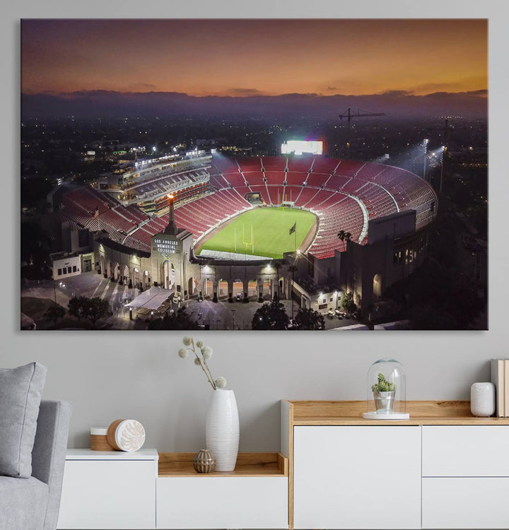 The USC Trojans Stadium canvas captures Memorial Coliseum at twilight, showcasing red seats and a green field beneath an orange sky.