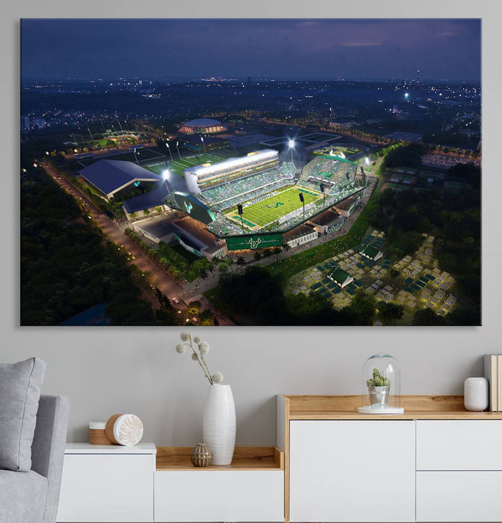 The USF Bulls Football Team Wall Art Canvas Print showcases the Tampa USF Football Stadium at night with city lights.