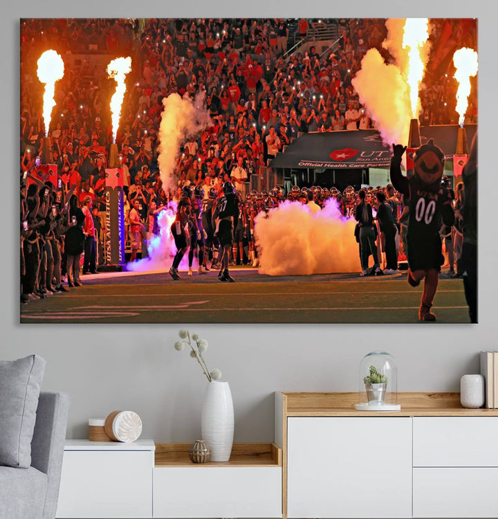 This canvas print captures the UTSA Roadrunners storming the Alamodome under smoke and fire.