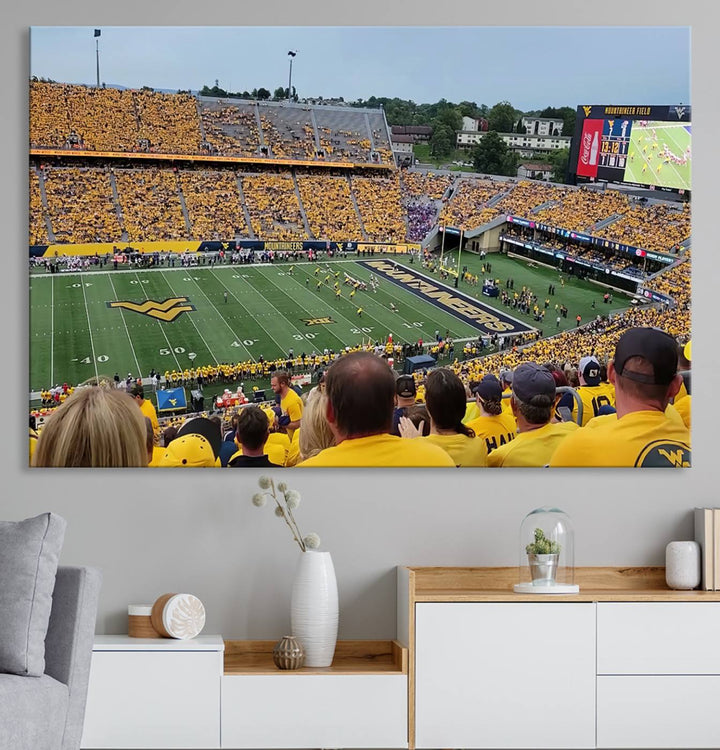 A Puskar Stadium canvas print decorates the modern living room shelf.