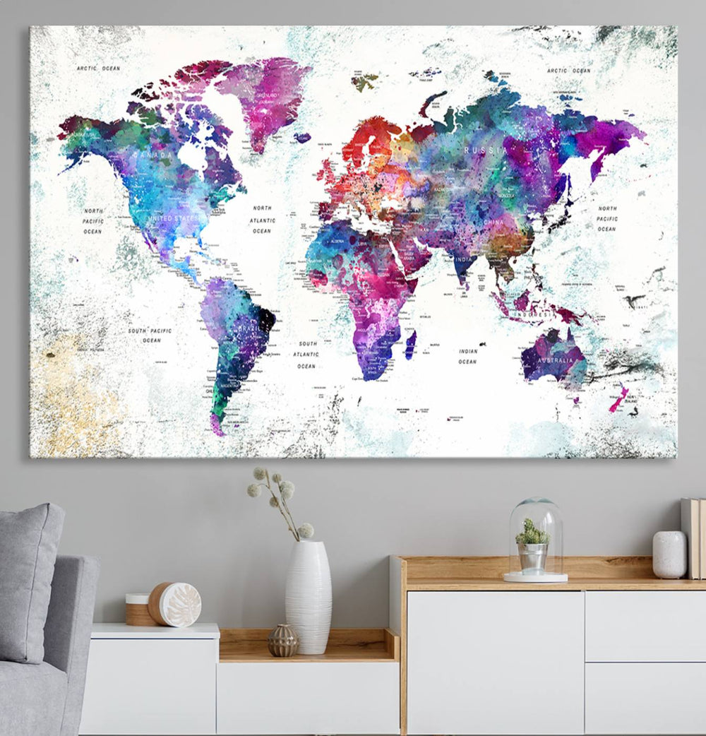 The 3-panel canvas wall art features a vibrant abstract watercolor world map, ideal for enhancing any space.