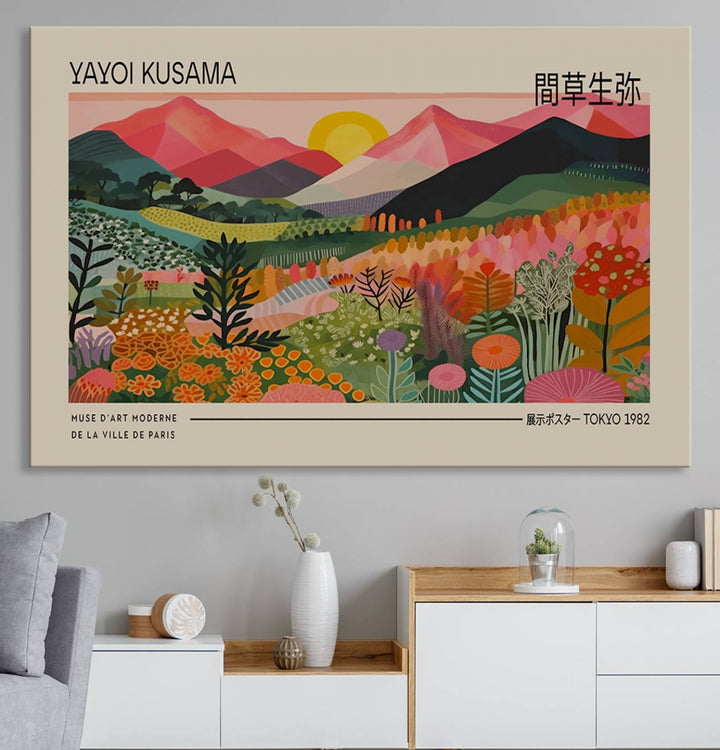 A vibrant abstract triptych features mountains, a sun, and plants in Yayoi Kusamas style with Japanese and French text included.