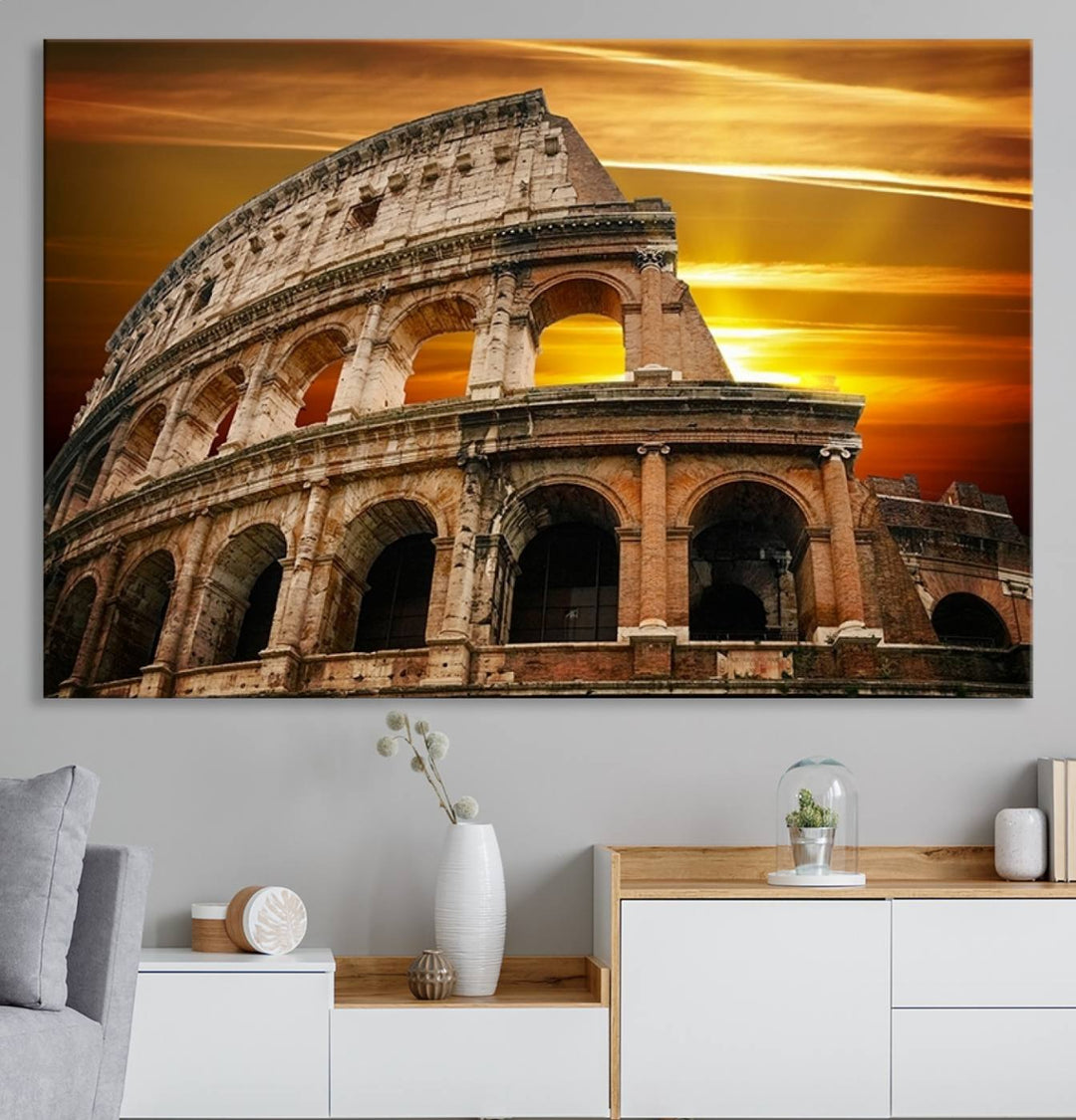 On the wall, theres a piece of art titled Colosseum with Yellow Sunset Behind, Italy.