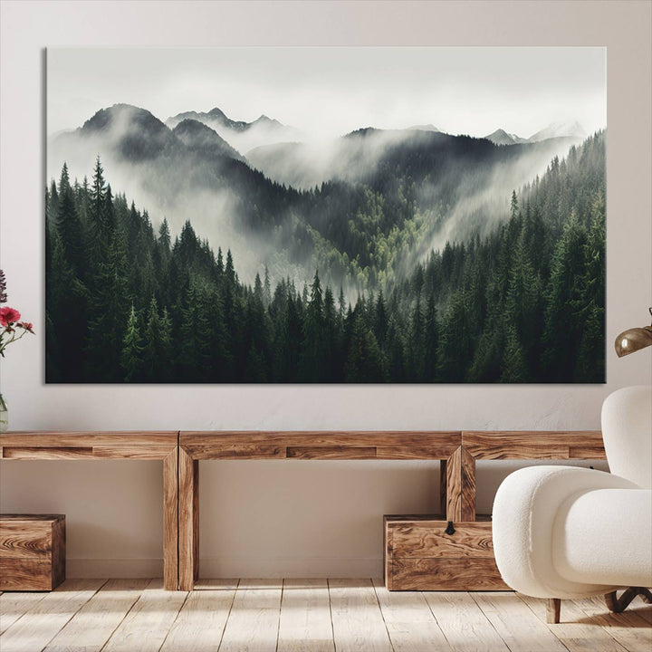 The Misty Forest Canvas Print Wall Art captures a serene misty forest scene with fog and mountains.