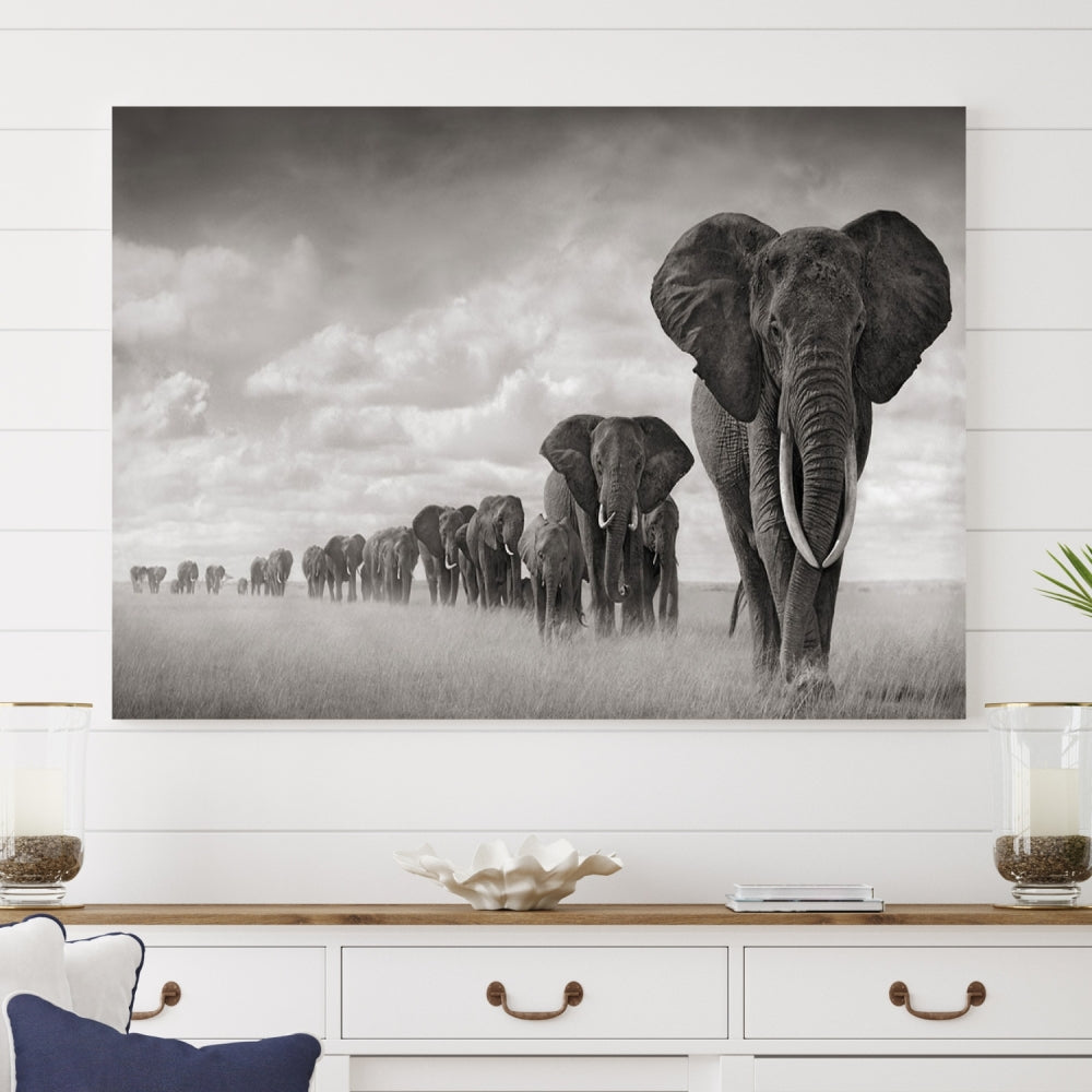 The Elephant Wall Art Canvas Print features a triptych of elephants in a savanna, elegantly displayed.