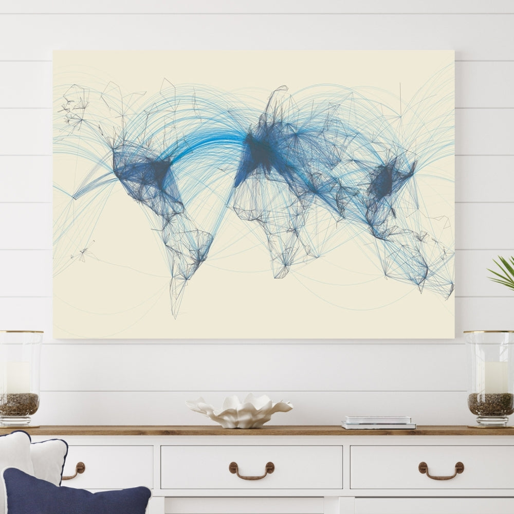 The Flight Routes Map art, featuring an abstract world map with blue connections representing global networks, is a three-panel canvas wall art piece.