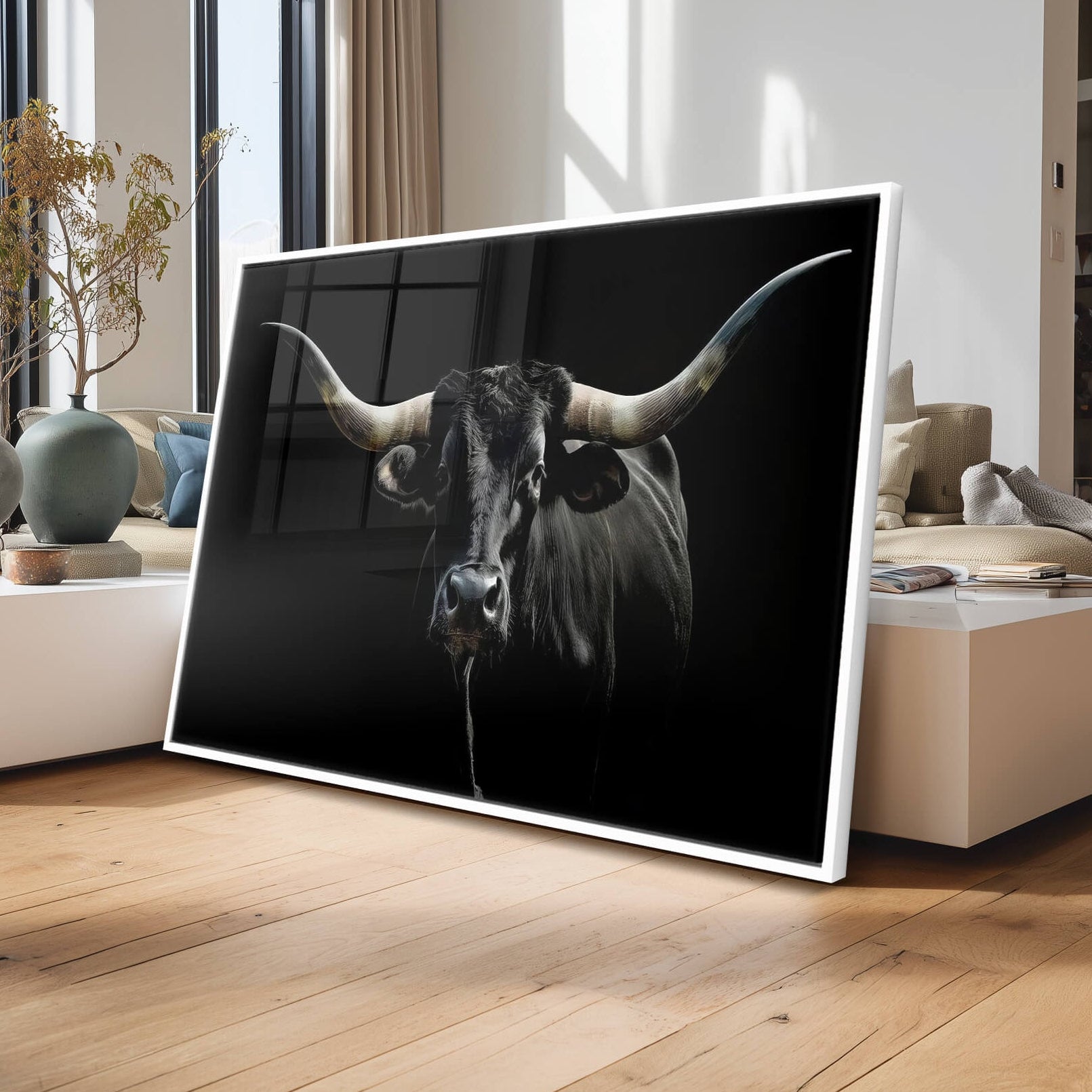 Modern living room with a large flat-screen TV displaying an image of a longhorn cow.