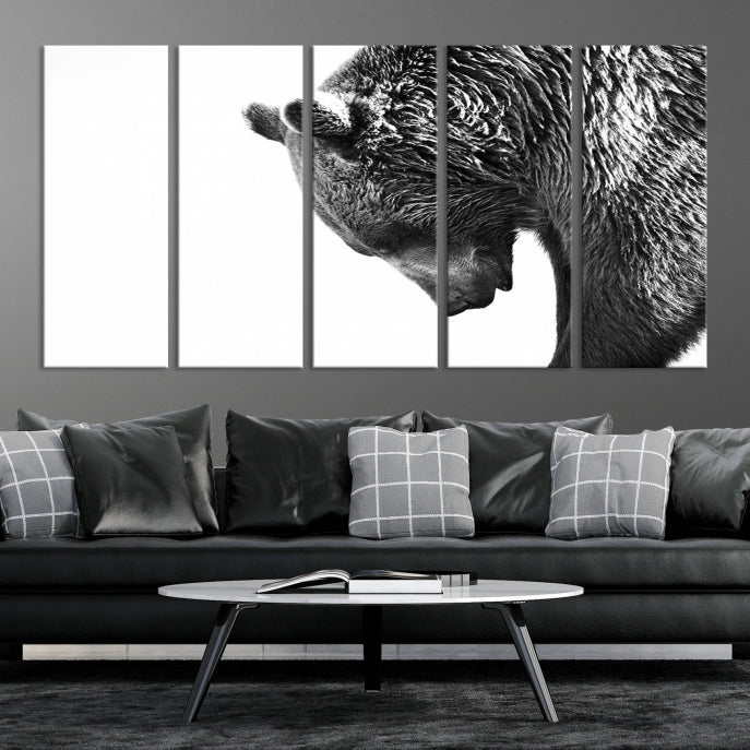 A black and white triptych from the "Black and White Grizzly 399 Bear Canvas Print Wall Art" collection decorates the dark wall.