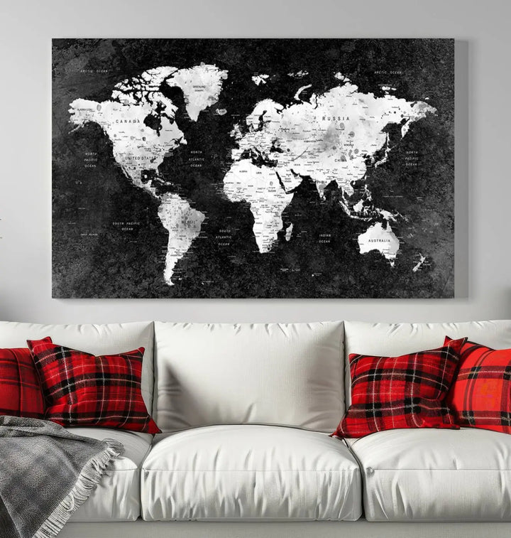 The Modern Grayscale World Map 3-Panel Canvas Art, ready to hang and framed, stylishly adorns the space above the sofa in a contemporary living room. It complements the minimalist décor with its black and white tones.