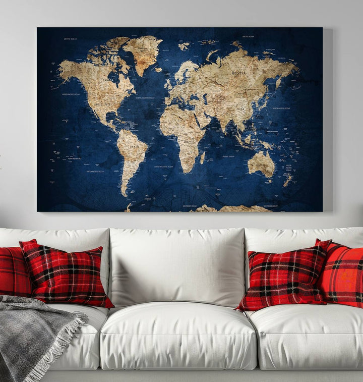 A triptych canvas print titled "Vintage Blue World Map Canvas Print - Classic World Map Design on Deep Blue Wall Art Print" adorns the wall, enhancing the decor with its antique style.