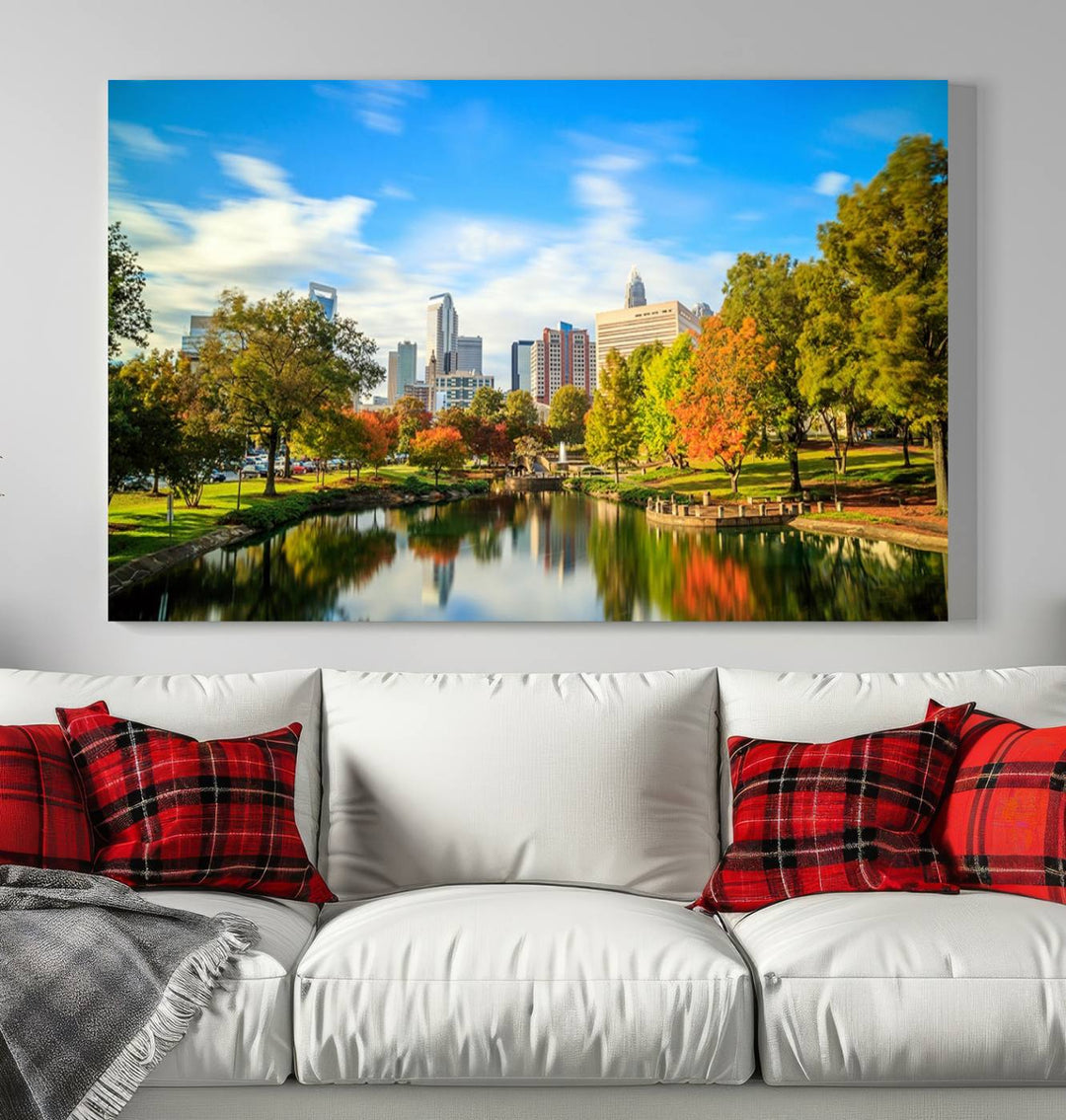 The Charlotte City Park at Spring Skyline Cityscape View wall art canvas print is a triptych featuring a scenic park with a lake and city skyline. It is gallery-wrapped on museum-quality canvases.