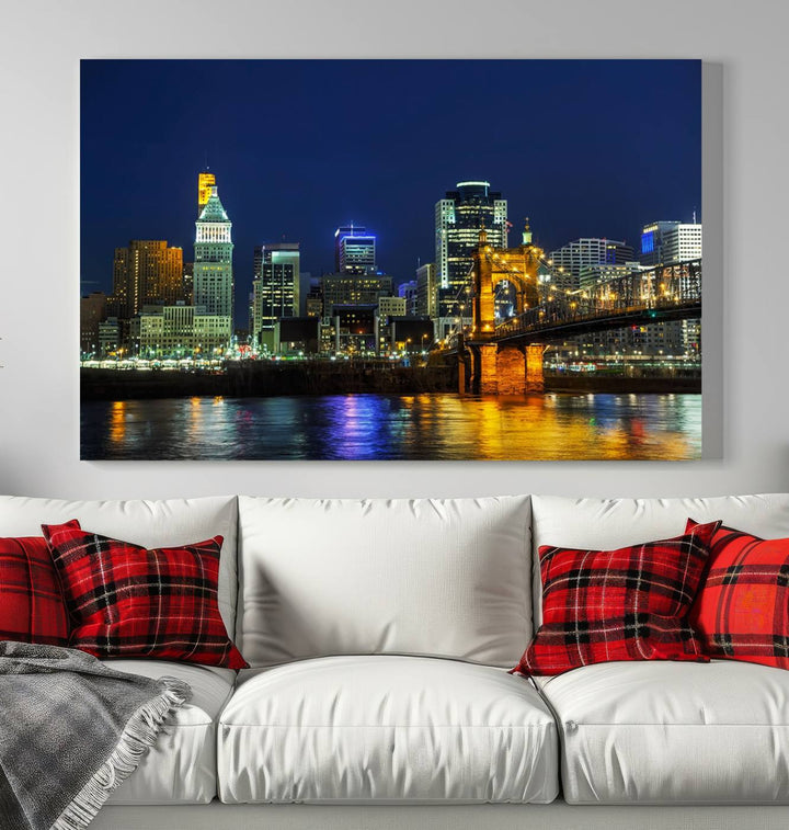 The "Cincinnati City Lights Night Skyline Cityscape" canvas print, displayed above a sofa, exhibits museum-quality craftsmanship with a UV-protective coating.