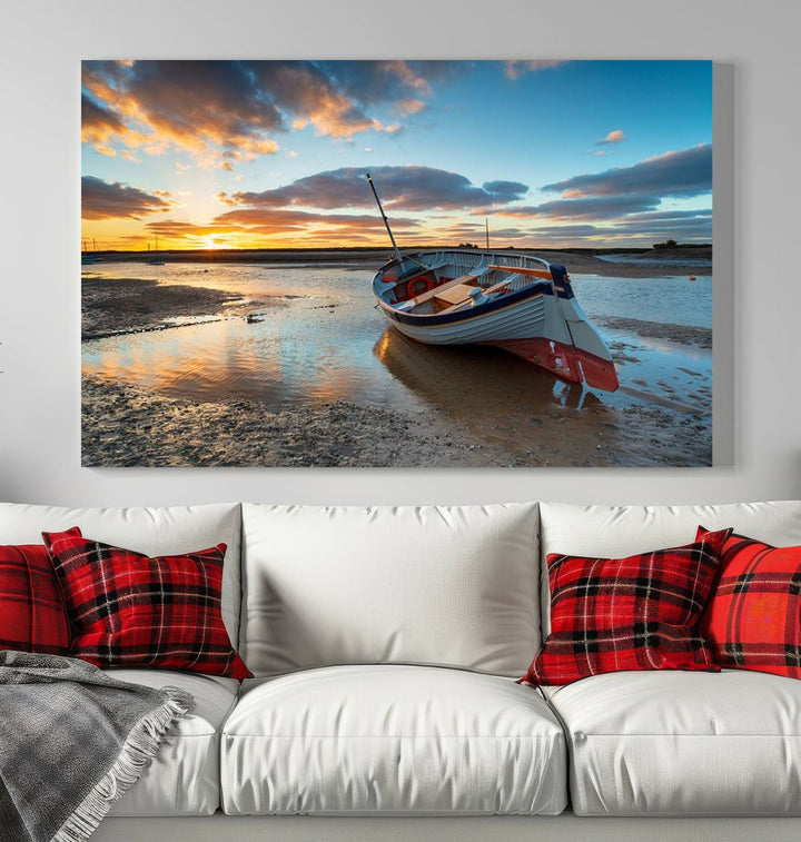 The "Small Boat At The Beach Sunset Wall Art Canvas Print," a three-panel masterpiece crafted on museum-quality canvas, hangs elegantly.