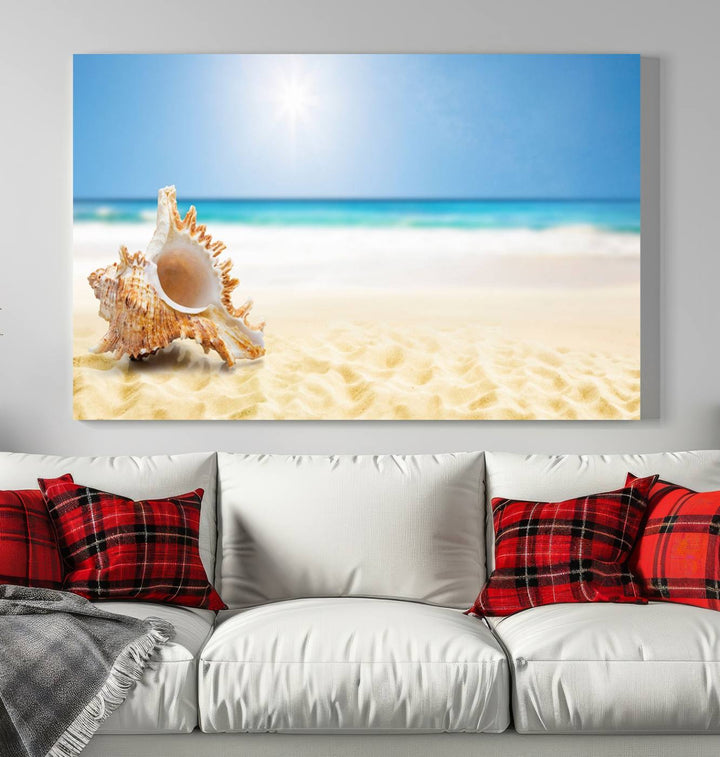 The Sea Shell on The Beach Sun Sand Wall Art Canvas Print is a triptych that beautifully captures a beach scene with a large seashell on the sand.