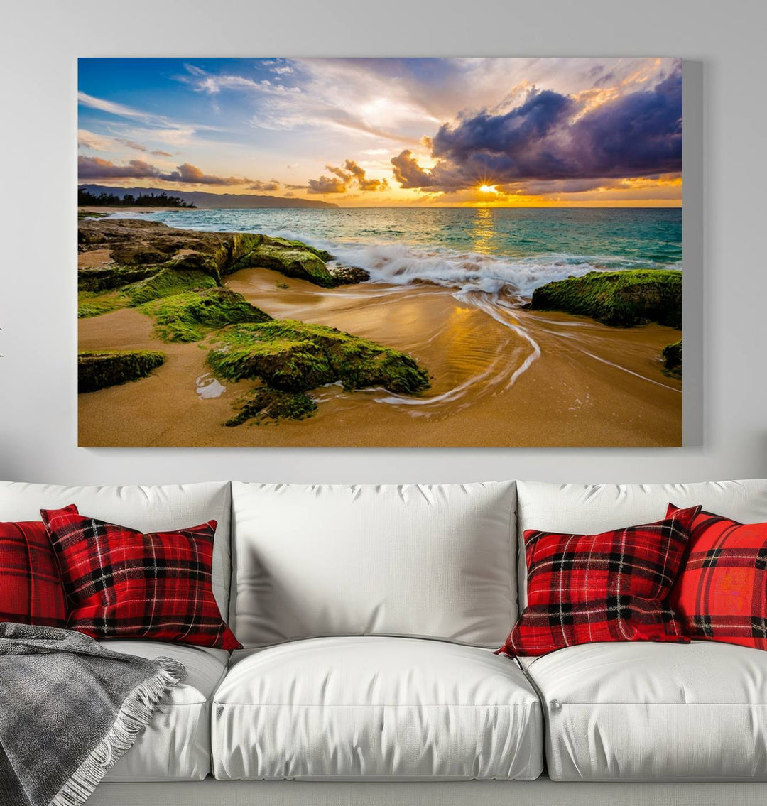 The Sunset Beach Wall Art Canvas Print is a gallery-wrapped triptych showcasing a beach scene with mossy rocks and a vibrant sunset. Made from museum-quality canvas and featuring a UV-protective coating, it elegantly provides both beauty and durability.