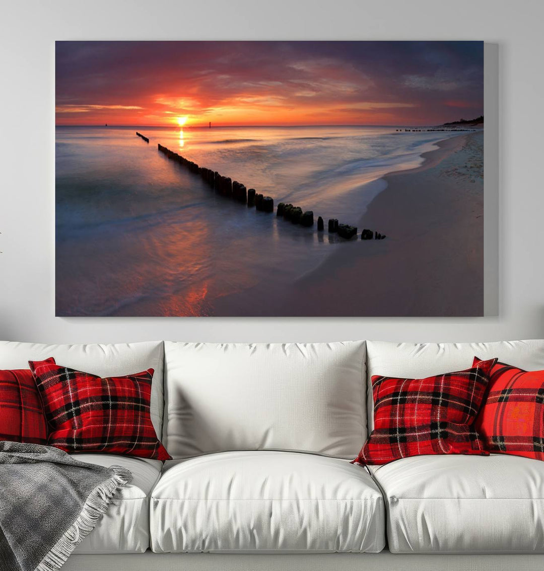 In a modern living room, the Sunset Beach Wall Art Canvas Print is displayed above. This triptych, printed on museum-quality canvas with a UV-protective coating, ensures lasting brilliance. It's ready to hang and brings an elegant touch to your space.