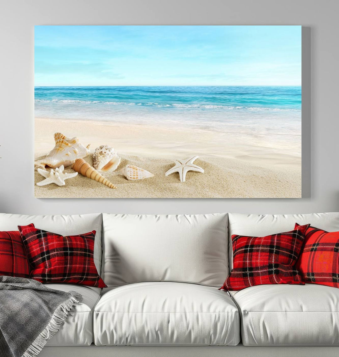 The "Turquoise Ocean View Seashell Starfish on the Beach Canvas Print Artwork" is a triptych piece that showcases a tranquil beach scene, complete with seashells and starfish adorning the sand. It is elegantly gallery-wrapped on museum-quality canvas.