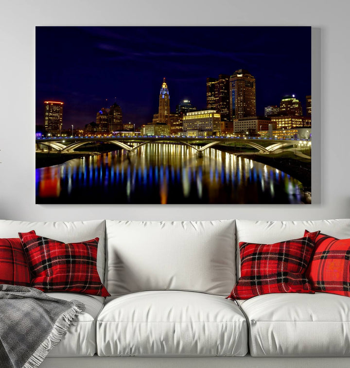 The "Columbus City Lights Night Skyline Cityscape View Wall Art Canvas Print" showcases a stunning city skyline at night, with illuminated buildings and bridges reflecting in the river, on a museum-quality canvas ready to hang.