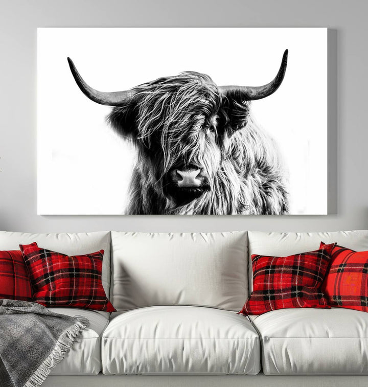 The Scottish Highland Cow Cattle Art Print Farmhouse Wall Art Canvas Print enhances rustic farmhouse decor with its depiction of a long-haired, large-horned cow. This triptych is an ideal choice for chic wall art.