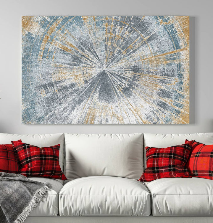 The Radiant Abstract Wood Rings Canvas Art, a modern triptych wall decor, enhances the contemporary style of the living room with its blue, white, and gold hues.