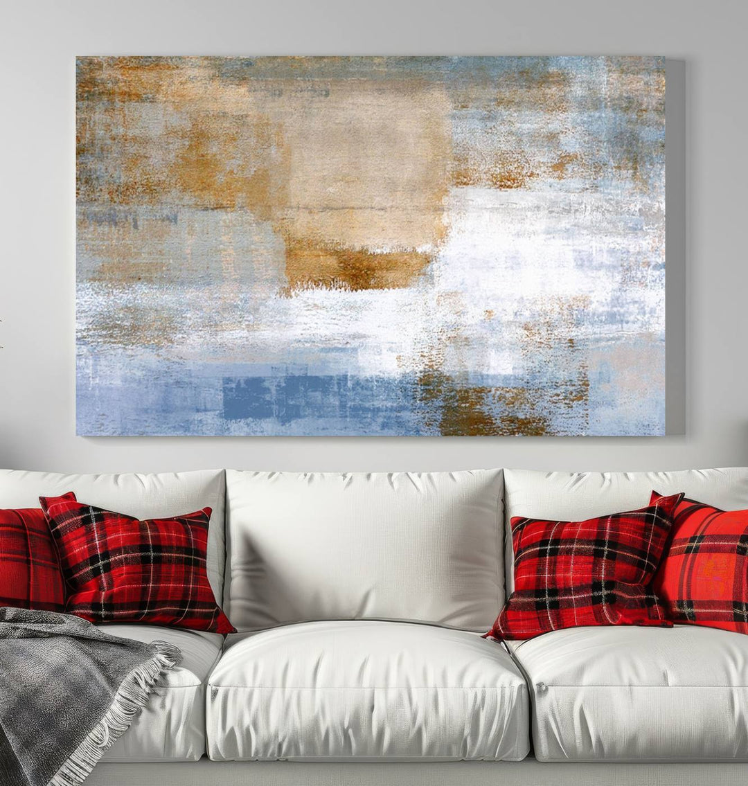 The Blue Multi Panel Abstract Wall Art Canvas Print, featuring an elegant blend of blue, beige, and brown tones, hangs gracefully on the wall, adding a contemporary touch to the space.