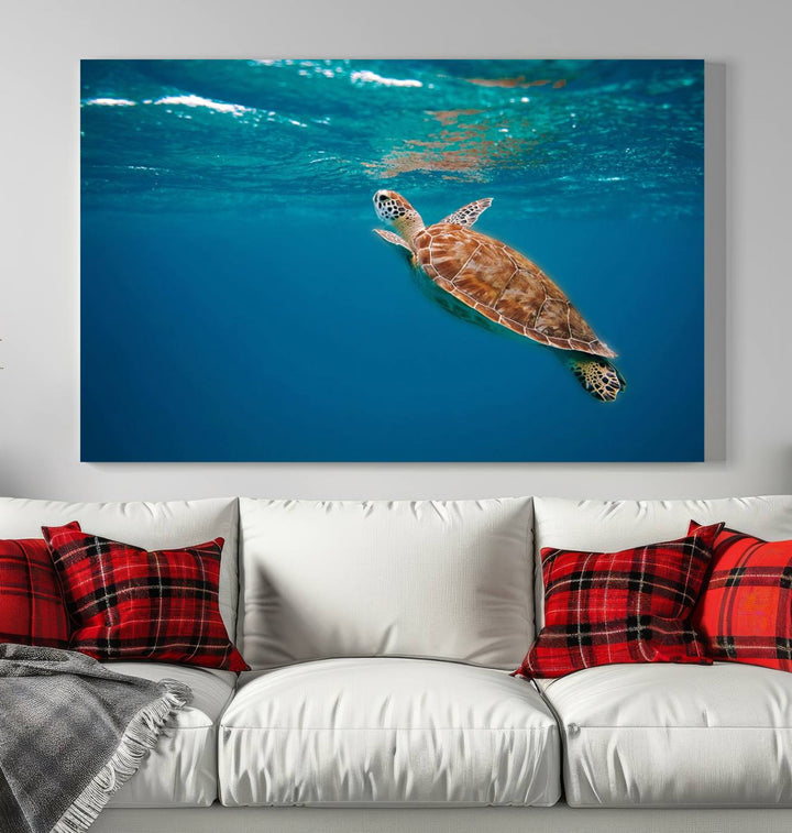 The living room features the "Baby Turtle in Ocean" wall art canvas print. This gallery-quality piece, depicting a sea turtle swimming underwater, adds an elegant touch to the space.