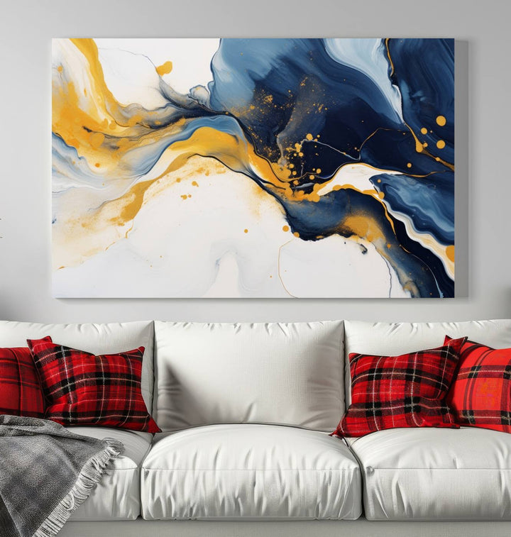 The Blue and Gold Abstract Fluid Canvas Art, with its swirling patterns, adorns the wall. This modern wall art beautifully complements the contemporary interior decor, adding an elegant touch with its rich blue, gold, and white tones.