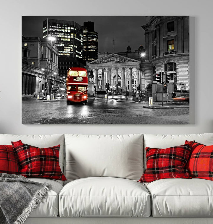 The London Night Red Bus Wall Art Canvas Print features a black and white cityscape with a moving red double-decker bus, crafted on museum-quality canvas with a UV-protective coating. This ready-to-hang artwork is designed to stand out and enhance any space.