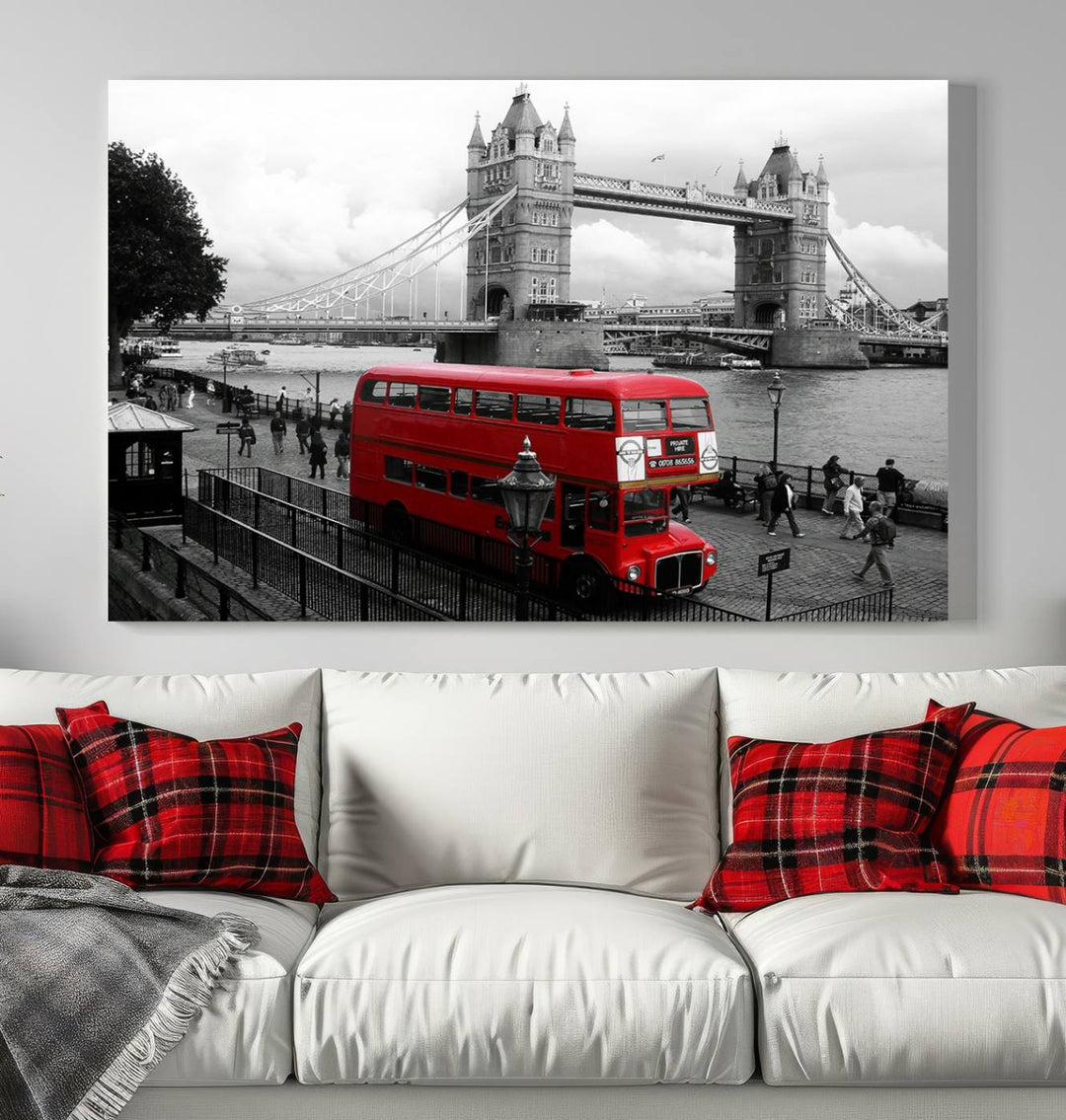 The London Red Bus and Bridge Wall Art Canvas Print showcases a red London bus in front of Tower Bridge, beautifully presented as a gallery-wrapped canvas. This striking image is divided into three panels, delivering a museum-quality display that's ready to hang.