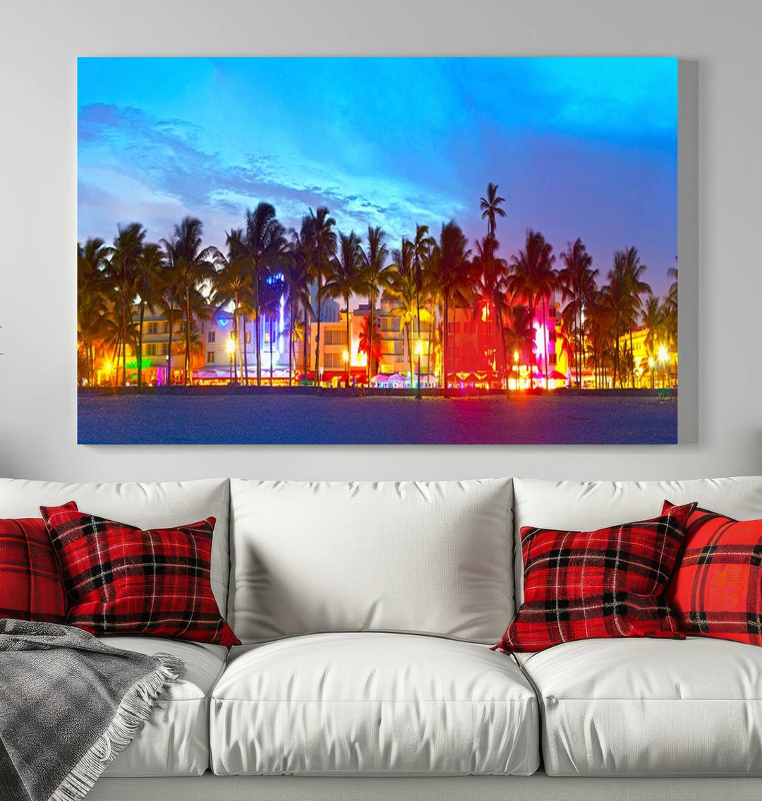 The living room features a three-panel Miami City Wall Art Canvas Print, showcasing a colorful, illuminated beach scene with palm trees on museum-quality canvas.