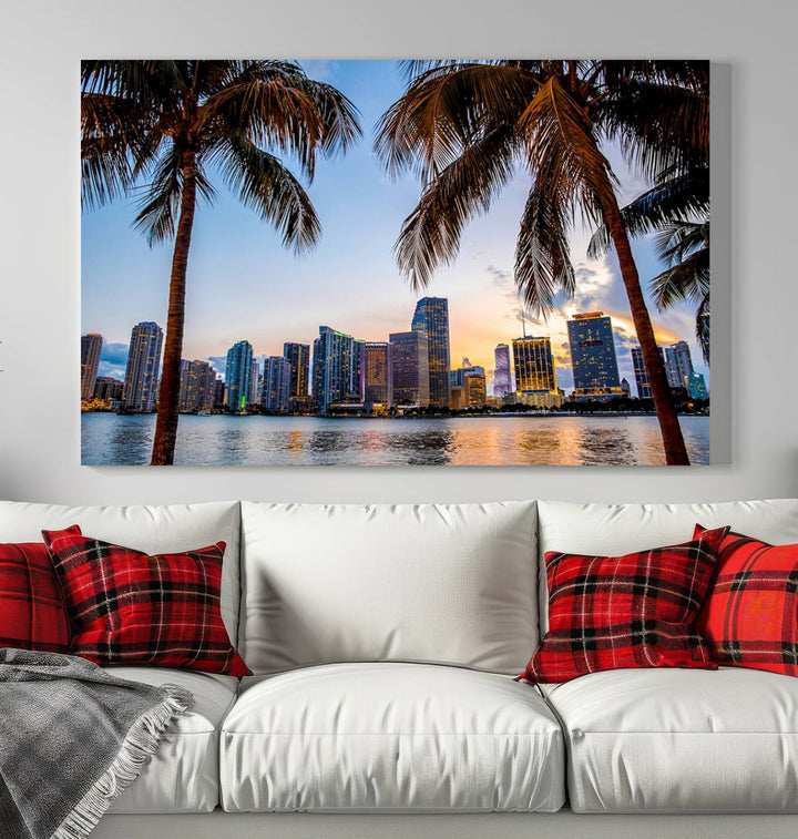 The Wall Art MIAMI Canvas Print features a triptych design depicting palm trees and a city skyline at sunset.