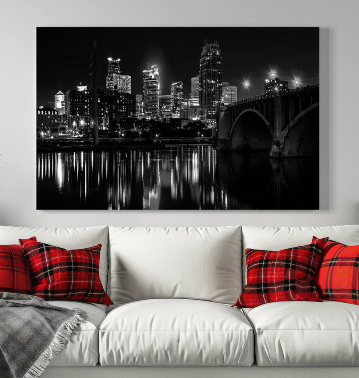 The "Minneapolis Wall Art Canvas Print, Minnesota City Wall Art Print, Minnesota Cityscapes Wall Art" features a black and white triptych of a city skyline with a bridge. Crafted on museum-quality canvas, this gallery-wrapped artwork is finished with a UV-protective coating to ensure lasting beauty.