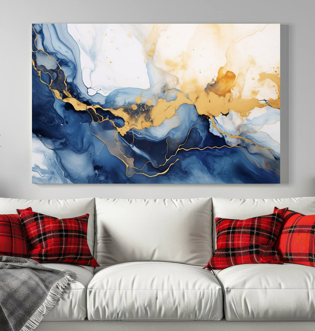 A contemporary living room featuring the "Navy Blue Gold Abstract Wall Art Canvas Print" on the wall, displayed on a gallery-wrapped, museum-quality canvas.