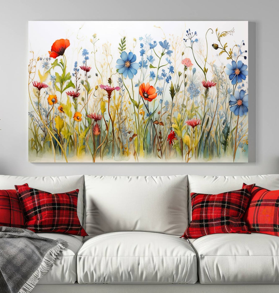 The Colorful Wildflower Canvas Wall Art – Vibrant Floral Botanical Print, consisting of a large 3 panel set, adds bright nature decor to the living room against a black wall.