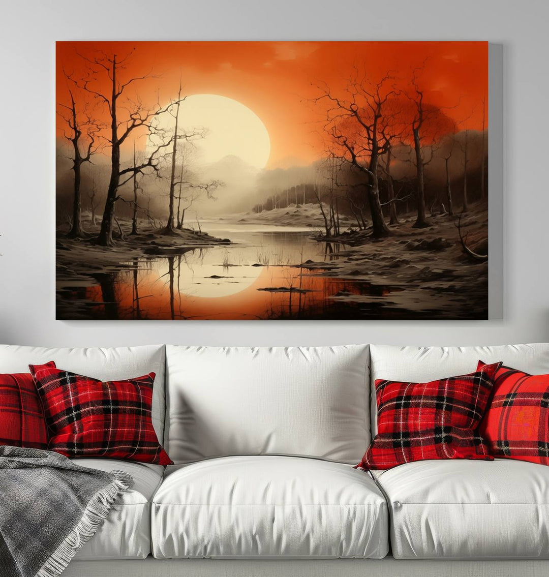 The "Abstract Watercolor Trees and Sunset on Lake Wall Art" is a triptych masterpiece, showcasing an orange-hued landscape of barren trees and a large sun. Displayed on museum-quality canvases with UV-protective coating, it creates a striking visual element in any space.