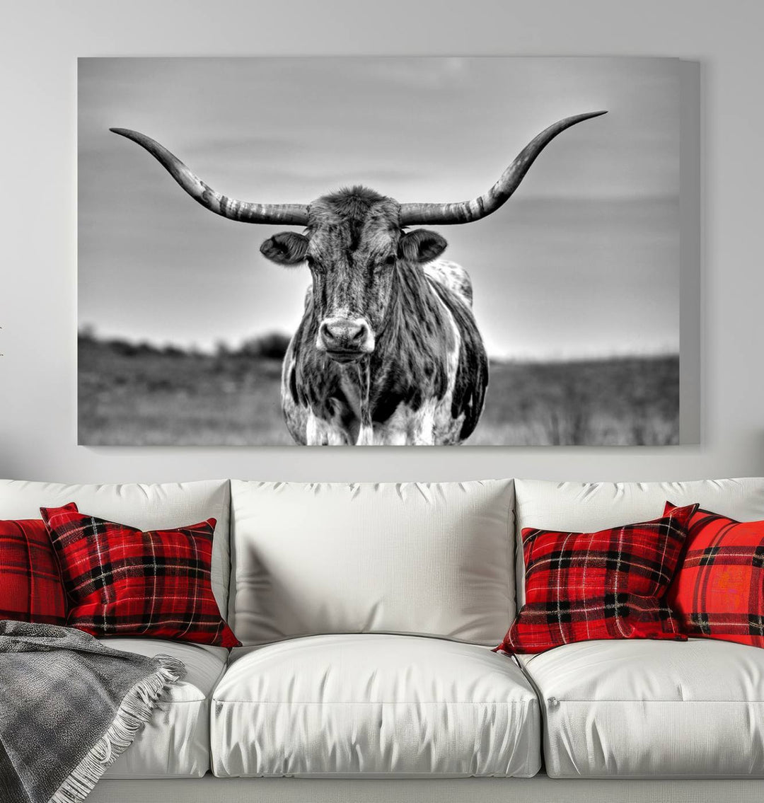 The Texas Longhorn Cow Wall Art, featuring a black and white image of a longhorn bull on canvas, brings charm to the room with its sophisticated appeal.